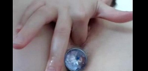  Teen hottie inserts ice cube in her pussy, anal toy in ass